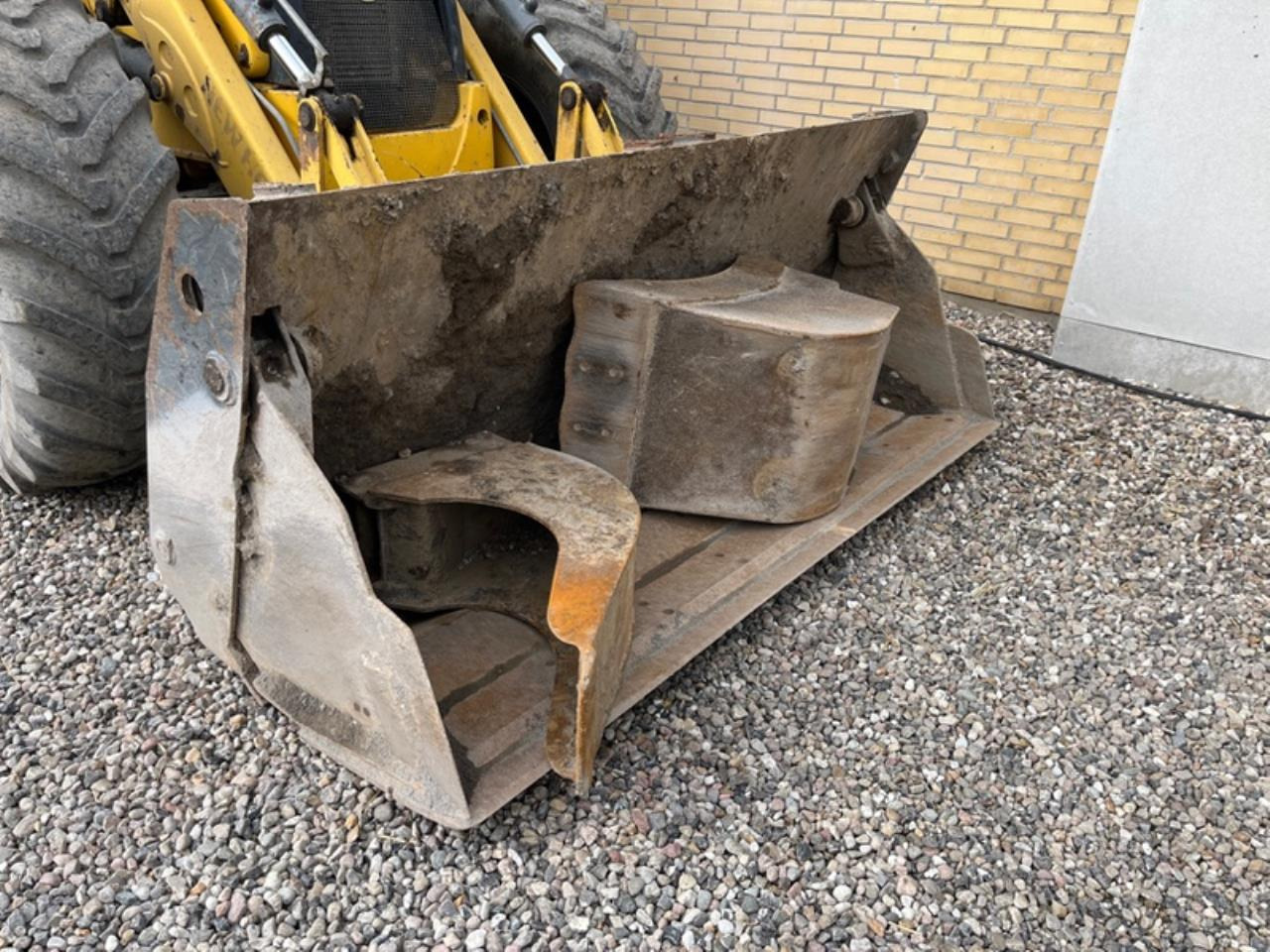 Grävlastare New Holland LB115