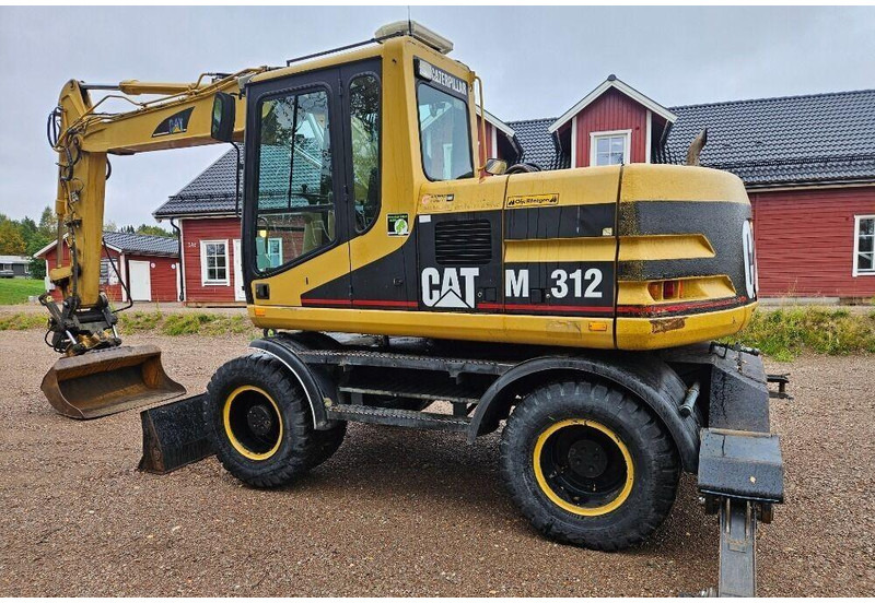 Grävmaskin på däck Caterpillar M312 Engcon EC20 tiltrotator