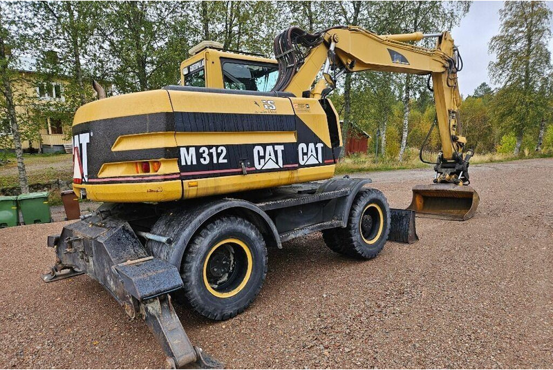 Grävmaskin på däck Caterpillar M312 Engcon EC20 tiltrotator