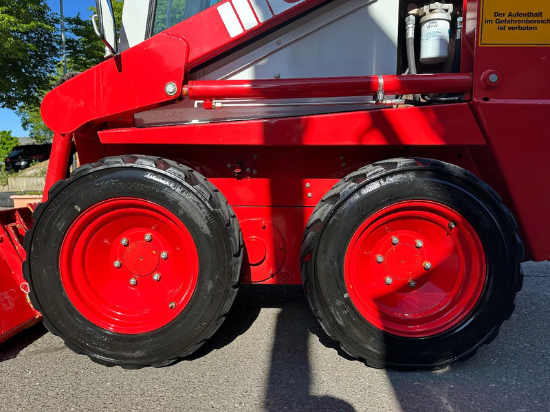 Kompakt bandlastare Case 1825 4x4 KOMPAKT / UNILADER mit Schaufel / Gabel