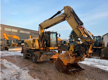 Grävmaskin på däck CATERPILLAR M315