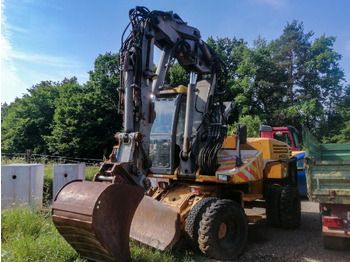 Grävmaskin på däck MECALAC