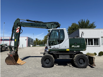 Grävmaskin på däck NEW HOLLAND