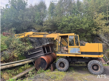 Grävmaskin på däck CATERPILLAR
