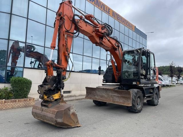 Hitachi ZX140W-5B - Grävmaskin på däck: bild 1 Hitachi ZX140W-5B - Grävmaskin på däck: bild 1
