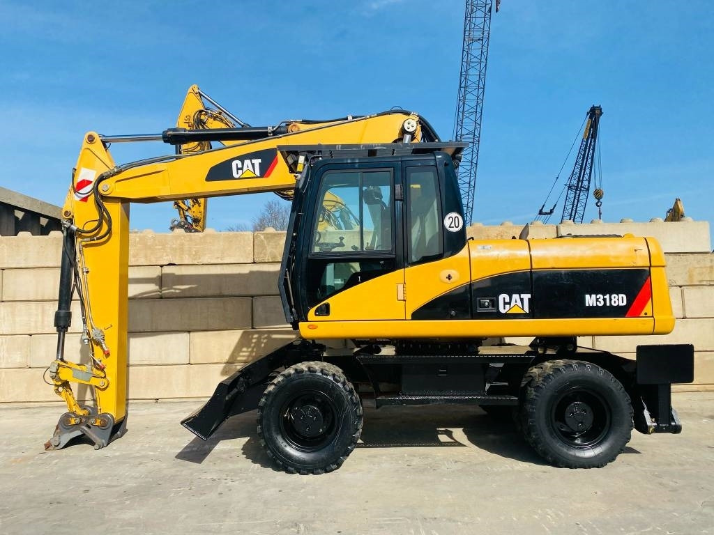 CAT M 318 D - Grävmaskin på däck: bild 1 CAT M 318 D - Grävmaskin på däck: bild 1