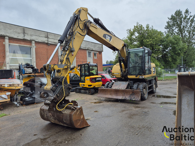Caterpillar M 315 D - Grävmaskin på däck: bild 1 Caterpillar M 315 D - Grävmaskin på däck: bild 1