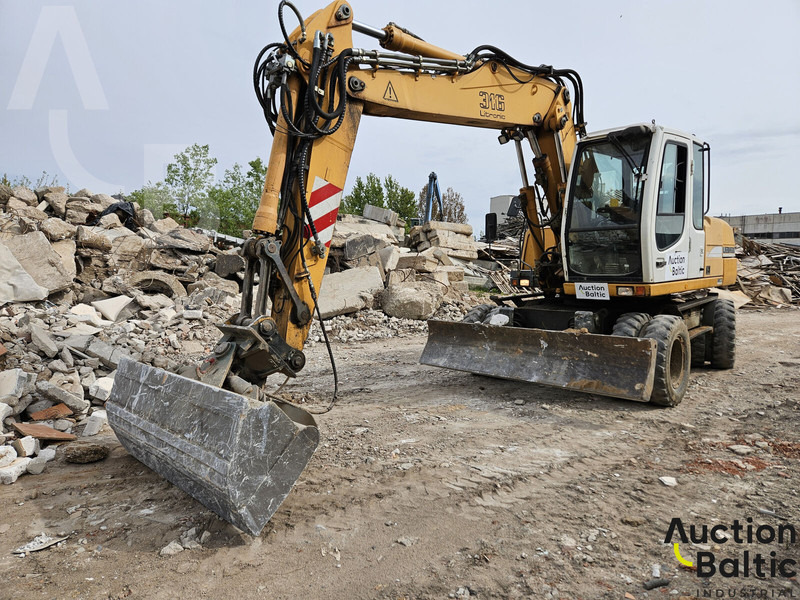Liebherr A 316 Litronic - Grävmaskin på däck: bild 1 Liebherr A 316 Litronic - Grävmaskin på däck: bild 1