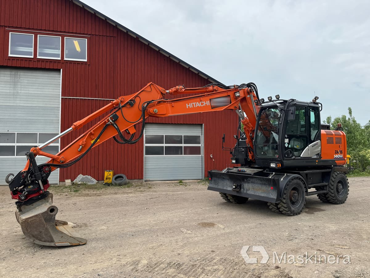 Hjulgrävare Hitachi Zaxis 140W med redskap - Bandgrävare: bild 1 Hjulgrävare Hitachi Zaxis 140W med redskap - Bandgrävare: bild 1