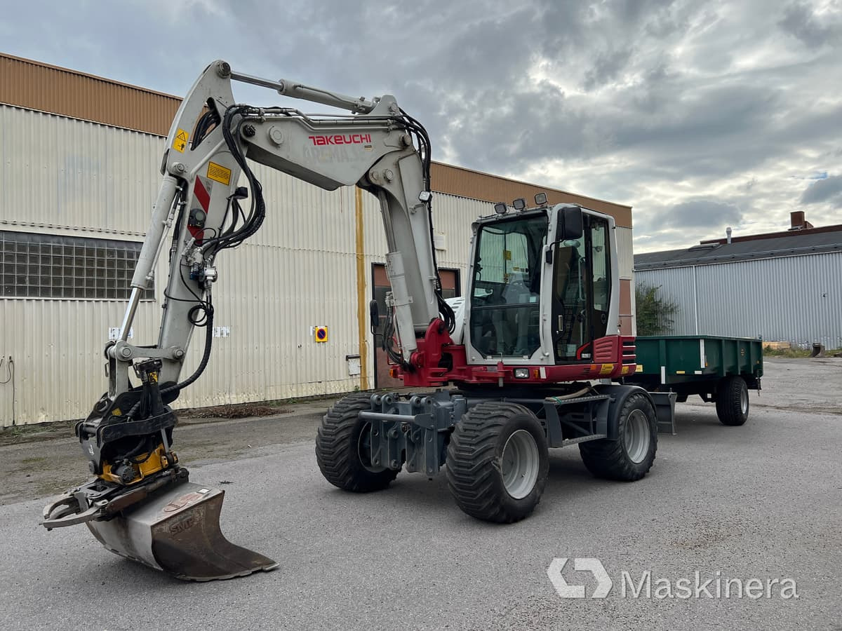 Hjulgrävare Takeuchi TB295W med vagn & redskap - Bandgrävare: bild 1 Hjulgrävare Takeuchi TB295W med vagn & redskap - Bandgrävare: bild 1