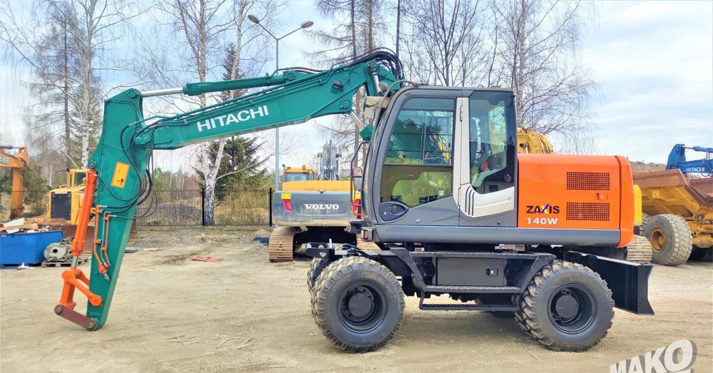 Hitachi ZX140W-3 - Grävmaskin på däck: bild 1 Hitachi ZX140W-3 - Grävmaskin på däck: bild 1