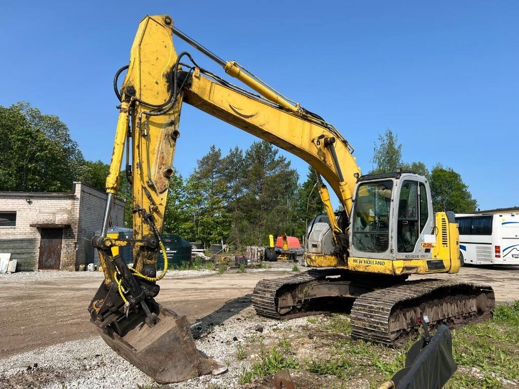 NEW HOLLAND KOBELCO E235BSRLC-2 - Bandgrävare: bild 1 NEW HOLLAND KOBELCO E235BSRLC-2 - Bandgrävare: bild 1