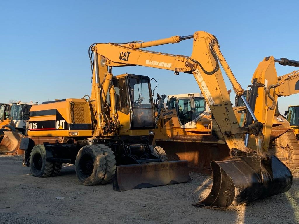 CAT M 315 - Grävmaskin på däck: bild 1 CAT M 315 - Grävmaskin på däck: bild 1