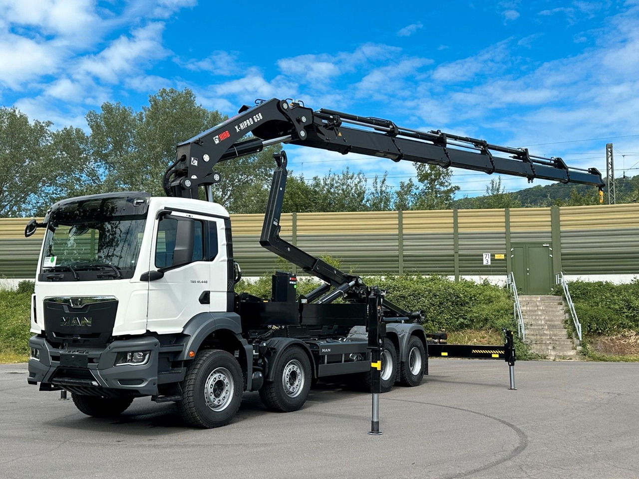 MAN TGS 35.520 8x4 Abrollkipper + Kran HIAB 658E6 - Lastväxlare lastbil, Kranbil: bild 1 MAN TGS 35.520 8x4 Abrollkipper + Kran HIAB 658E6 - Lastväxlare lastbil, Kranbil: bild 1