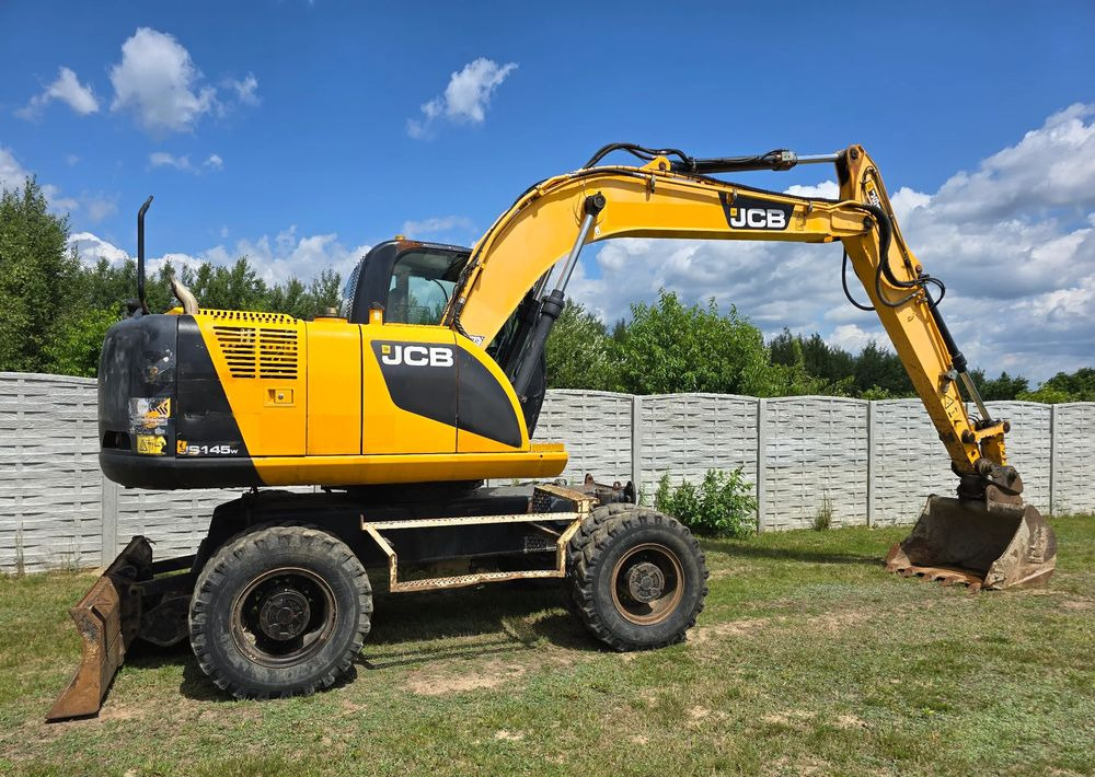 JCB - Grävmaskin på däck: bild 2 JCB - Grävmaskin på däck: bild 2