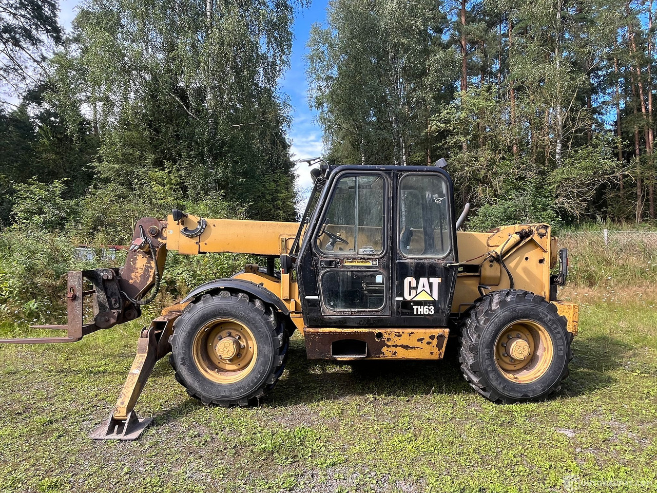 Caterpillar TH63, kurottaja piikeillä ja kauhalla, 2002, Loppi - Lantbruksmaskiner: bild 3 Caterpillar TH63, kurottaja piikeillä ja kauhalla, 2002, Loppi - Lantbruksmaskiner: bild 3