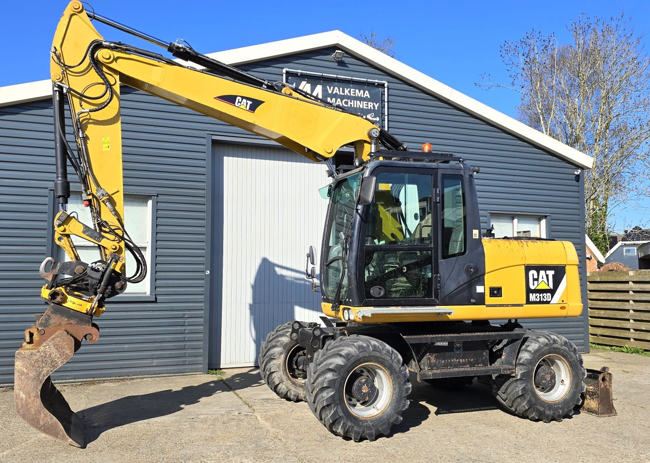 CATERPILLAR M313D - Grävmaskin på däck: bild 1 CATERPILLAR M313D - Grävmaskin på däck: bild 1
