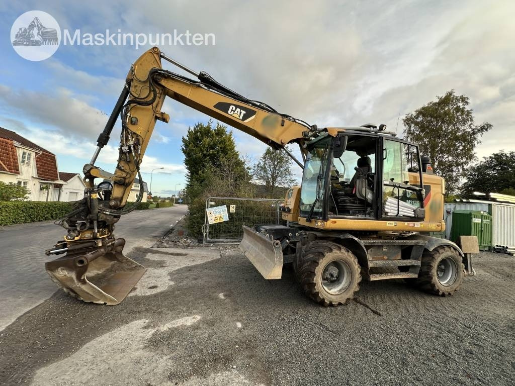 CAT M 317 - Grävmaskin på däck: bild 1 CAT M 317 - Grävmaskin på däck: bild 1
