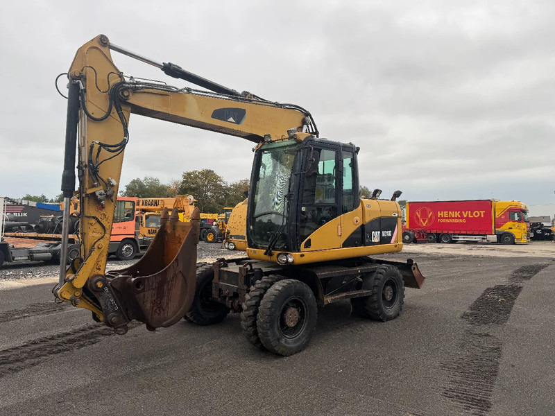 Caterpillar M313D 7212 HOURS - Grävmaskin på däck: bild 1 Caterpillar M313D 7212 HOURS - Grävmaskin på däck: bild 1