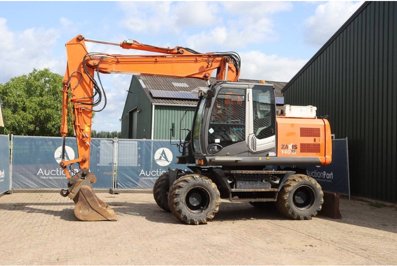Hitachi ZX140W-3 - Grävmaskin på däck: bild 1 Hitachi ZX140W-3 - Grävmaskin på däck: bild 1