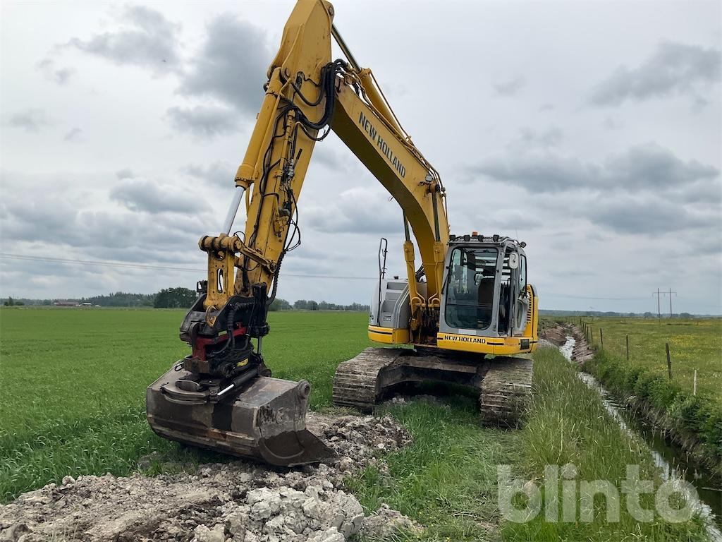 New Holland kobelco E235 B se - Bandgrävare: bild 1 New Holland kobelco E235 B se - Bandgrävare: bild 1
