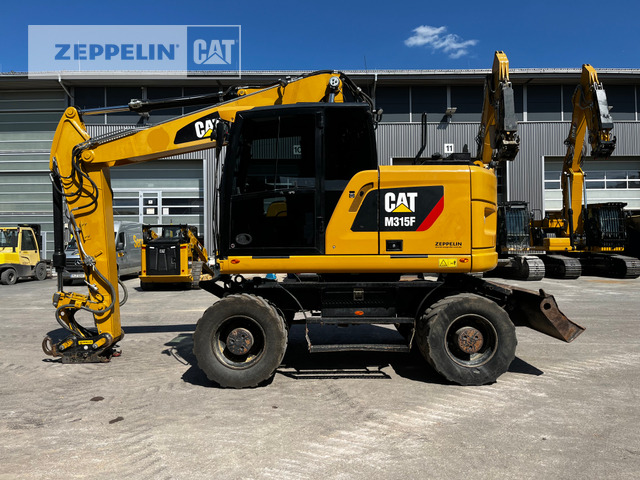 Cat M315F - Grävmaskin på däck: bild 1 Cat M315F - Grävmaskin på däck: bild 1